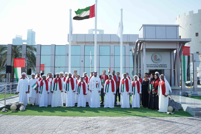 Sheikh Mohammed bin Sultan bin Khalifa Al Nahyan raises the flag on Flag Day
